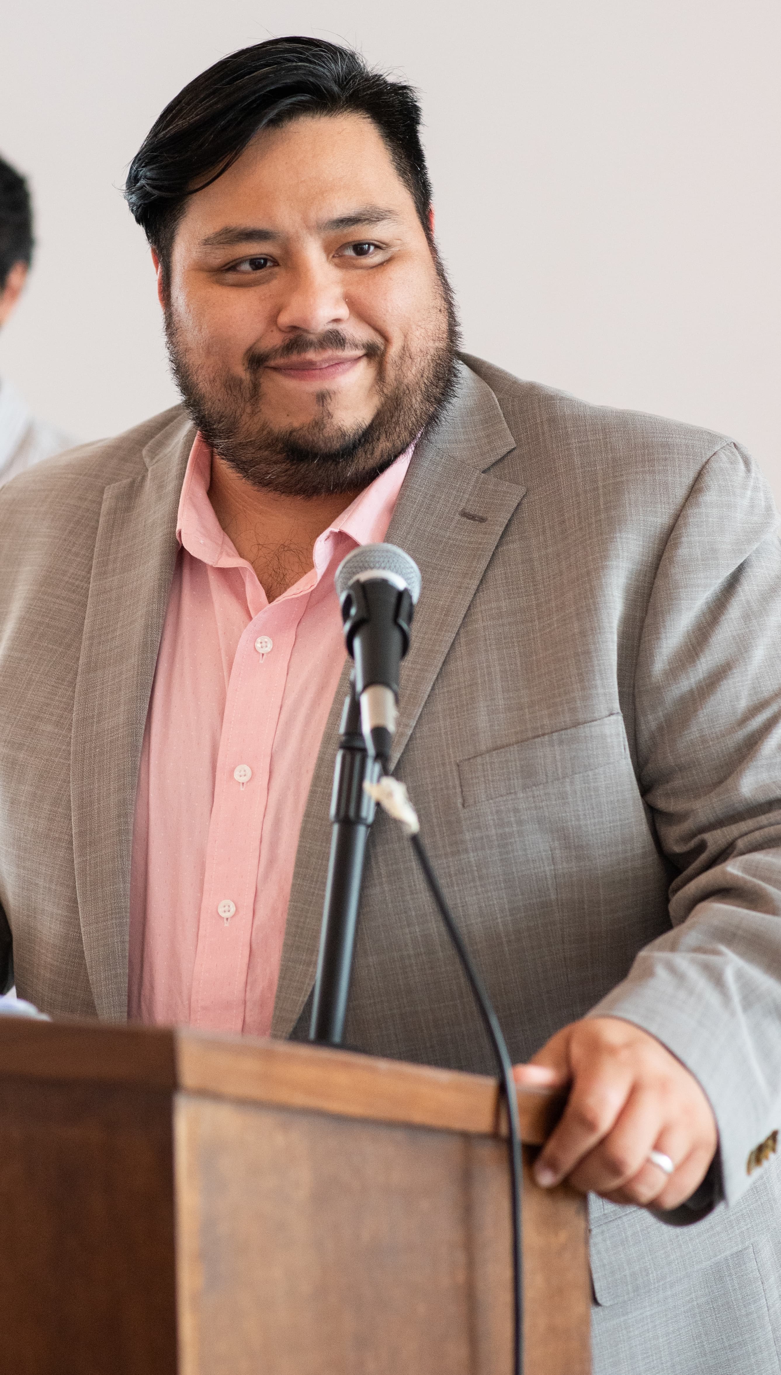 Gonzalo Romero speaking at a podium